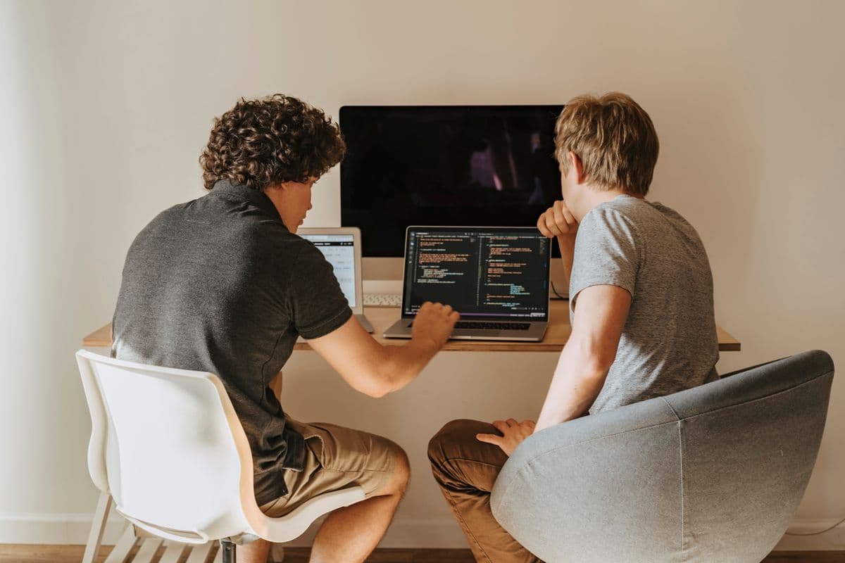 Two developers working side by side